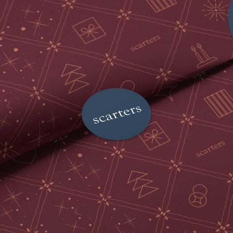 Scarters festive gift wrap with the navy scarters seal